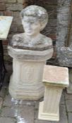 2 classical garden columns and the bust of a young man (with broken nose)