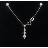 18ct white gold diamond set pendant and pair of diamond stud earrings