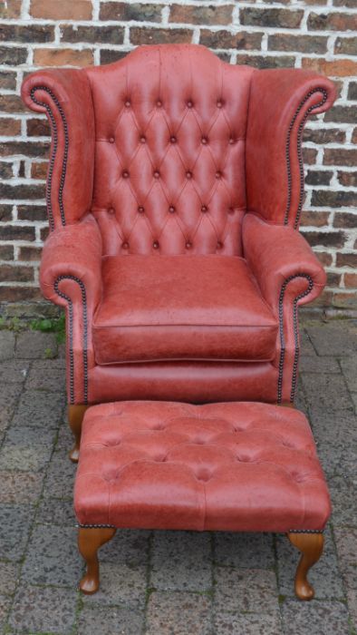 Red leather button back arm chair and stool