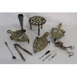 Brass trivets, white metal candle snuffer, nutcracker, vase and boot hooks one with Whitby jet
