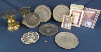 Collection of pewter plates, silver plate picture frame and brass lamps