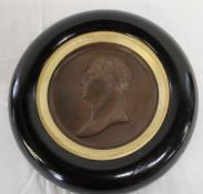 Bronze portrait roundel depicting Napoleon marked Andrieu in circular ebonised frame, diameter 23cm