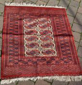 Persian red ground rug 110cm by 90cm