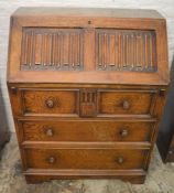 Oak bureau with linen fold panels Ht 100cm D 44cm W 77cm