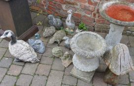 Various garden ornaments including ducks, frogs and bird bath