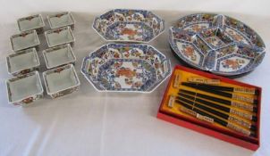 Oriental dinner ware including serving dishes, lazy Susan, chop sticks and bowls