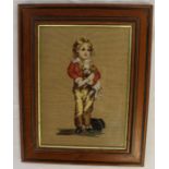 Framed needlepoint depicting Victorian boy holding a dog, frame size 29cm x 37cm