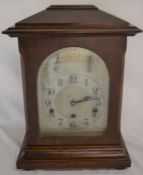 Early 20th century bracket clock in an oak case with a chiming mechanism