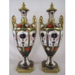 Royal Crown Derby style (labels scratched out) Imari pattern urns with covers approx. height 41.