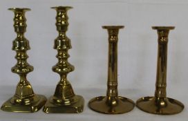 Pair of brass candlesticks with pushers and one other pair