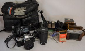 Olympus OM10 SLR camera with two other cameras, Super Paragon 35-200 zoom lens & other accessories