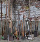 Large quantity of garden tools including pitch forks, spades, axe & butchers cleavers etc