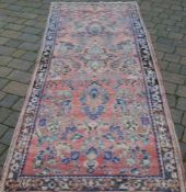 Washed red ground Persian runner 290cm by 113cm