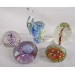 Collection of glass paperweights including Caithness 'pebble' and mosaic flower and an elephant
