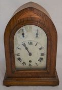 Early 20th century oak case dome top mantel clock with chiming mechanism & inlaid decoration Ht 38cm