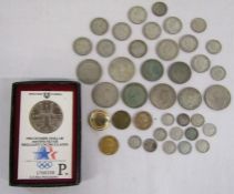 Collection of coins including 1984 Olympic Dollar .900 fine silver uncirculated, mounted coin,