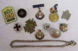 Collection of pin badges and pendants including St John's Ambulance, God Save The King pendant,