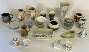 Various ceramic items including vases, tea cups, etc