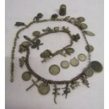 White metal watch chain with large selection of charms some silver, also includes silver thimble and