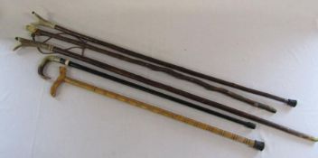 5 walking sticks and thumb sticks, some with horn handles