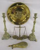 Pair of brass candlesticks, powder flask, wall plate and scales with weights