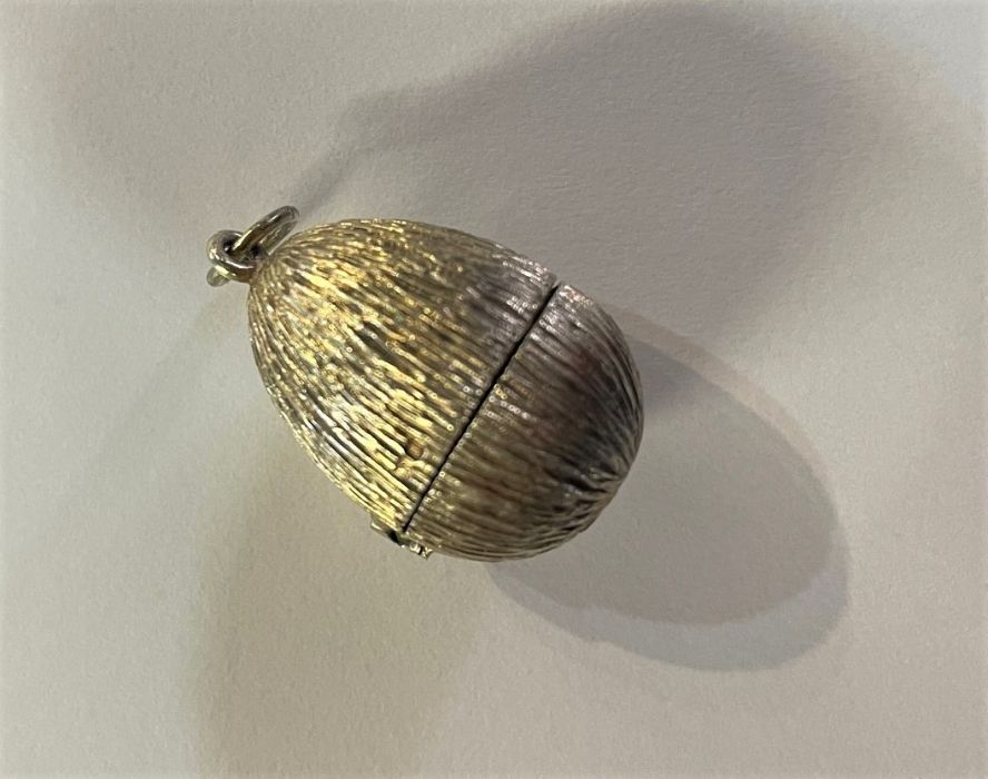 Stuart Devlin silver gilded 'Surprise' egg pendant opening to reveal enamelled flowers and - Image 6 of 8
