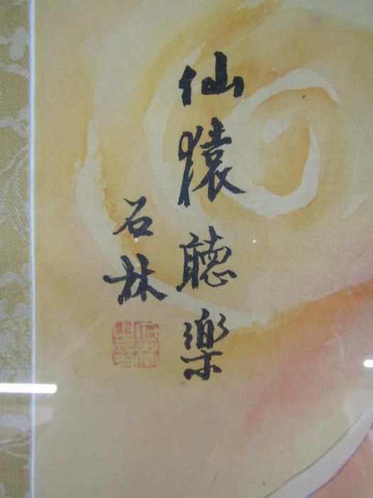 Pair of Chinese oriental pictures depicting Kuan Yin one with a baby and dragon and the other with a - Image 3 of 5