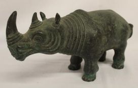 Bronze rhinoceros figure approx. 25.5cm long and 13cm tall