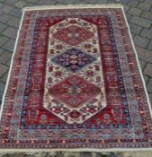 Red & ivory ground cashmere full pile medallion design Persian rug 170cm by 120cm