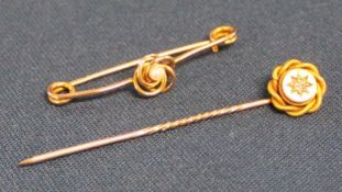 15ct gold diamond set stick pin (1.9g) & 9ct gold bar brooch central gold knot and pearl (1.6g)