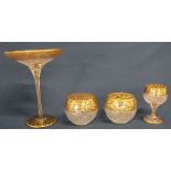 19th century cut glass tazza, matching wine glass and pair of bowls, hobnail cut with gilt floral