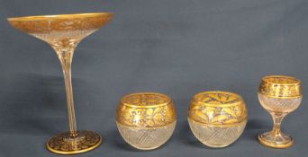 19th century cut glass tazza, matching wine glass and pair of bowls, hobnail cut with gilt floral