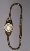 Ladies Accurist wristwatch with 9ct gold articulated strap and cut glass crystal (missing winder)