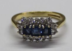 18ct gold 3 stone square cut sapphire ring surrounded by 14 diamonds size N