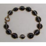 9ct gold (tested as) mounted banded agate bracelet (needs repair)