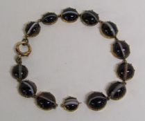 9ct gold (tested as) mounted banded agate bracelet (needs repair)