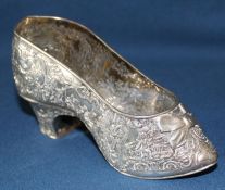 Hanau Germany silver decorative shoe with chased scenes and bow detail, 14cm wide, with English