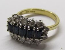 18ct gold ring with 5 baguette cut sapphires and 14 diamond surround - sapphire size approx 4mm -