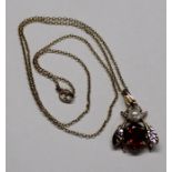 9ct gold insect pendant set with ruby and pearls on a fine 9ct gold chain 3.0g