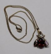 9ct gold insect pendant set with ruby and pearls on a fine 9ct gold chain 3.0g