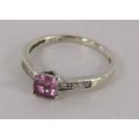 9ct white gold ring with diamond chips and pink topaz - ring size N/O - total weight 1.88g