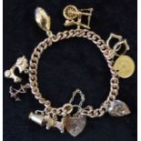 9ct gold charm bracelet with 9 charms (stamped 9ct or tested as) including a Peruvian 1/5 De