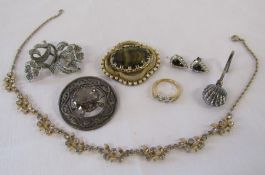 Collection of costume jewellery including ring, necklace, Scottish silver brooch and silver napkin