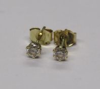 Pair of diamond stud earrings marked 585 (14ct gold)