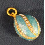 Russian style turquoise egg charm / pendant set with cubic zirconia on gold suspension ring marked