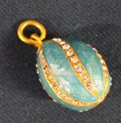 Russian style turquoise egg charm / pendant set with cubic zirconia on gold suspension ring marked