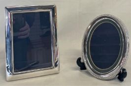 2 silver photo frames by Carrs of Sheffield 2002 - rectangular 13.5cm x 18.5cm and oval with rope