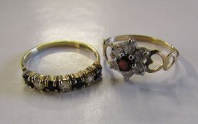 2 ladies rings - 9ct gold daisy ring set with garnet and cubic zirconia - total weight 1.12g -