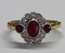 18ct gold ruby and diamond ring, total weight 3.0g - ring size M - central ruby approx. 5mm x 4mm