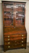 Georgian mahogany bureau bookcase with inlaid interior on bracket feet (back foot requires